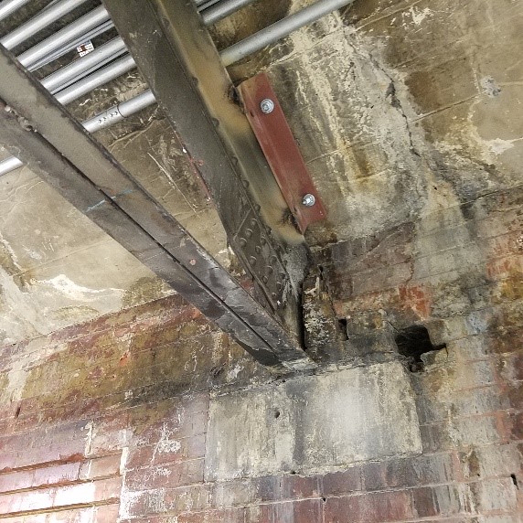White, chalky mineral efflorescence deposits on a basement masonry wall where moisture has been wicking through